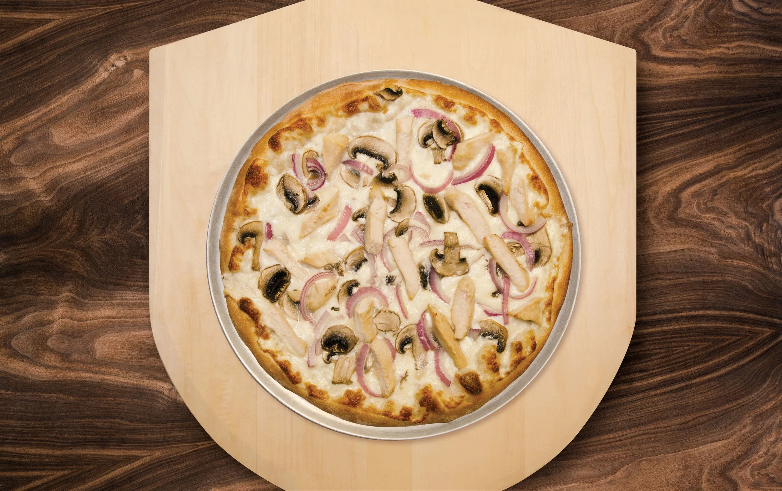 The Ranch Chicken pizza at Mik's Pizza is an absolute winner. The ranch white sauce replaces the traditional marinara, adding a creamy, tangy base that perfectly complements the tender, flavorful grilled chicken. Topped with a generous blend of mel