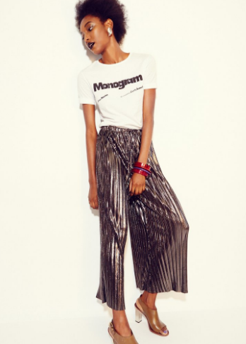 Come closer. Anything but basic white t-shirt plus metallic wide leg pleated pants.