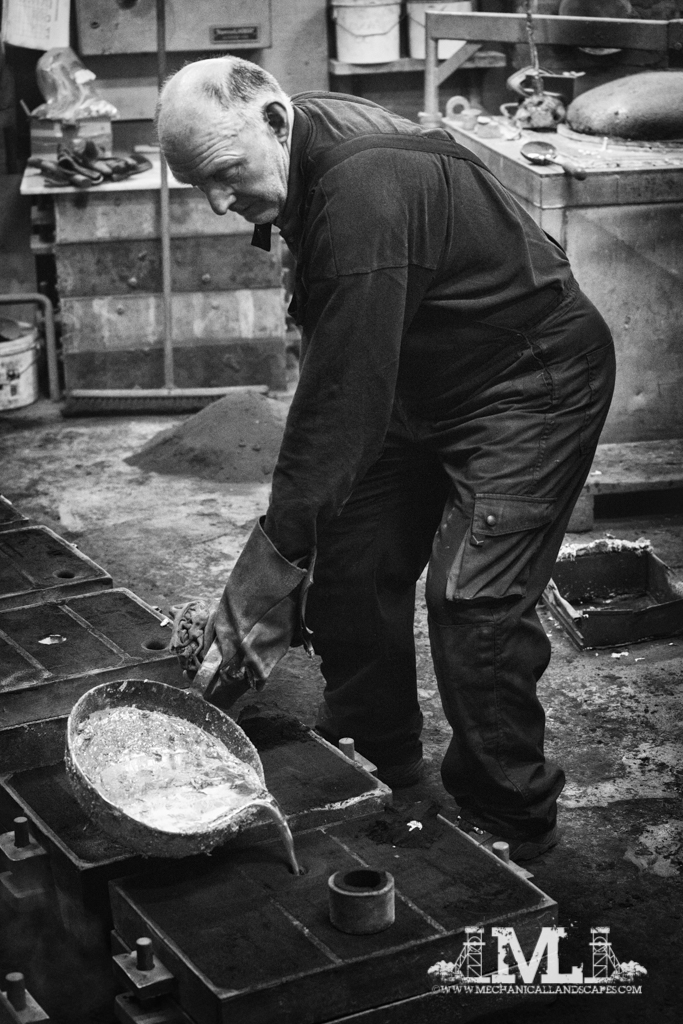 Pouring the molten aluminium into the moulds.