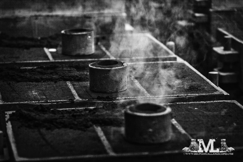 Steam venting from the casting boxes as they cool.