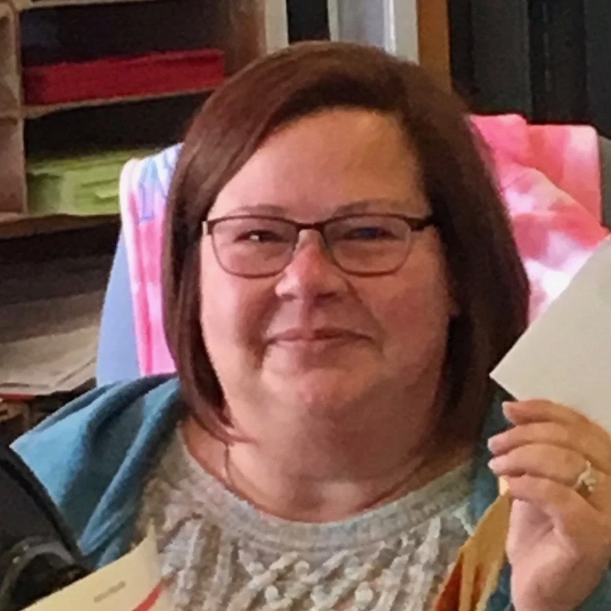 Omena’s Postmaster Lin Ruslischaub. Post office hours are 12 noon to 3:45 pm. Mail is usually ready for pick up at the boxes by 1 pm. The Post Office in Omena does not have window hours on Saturday- just mail pick-up.