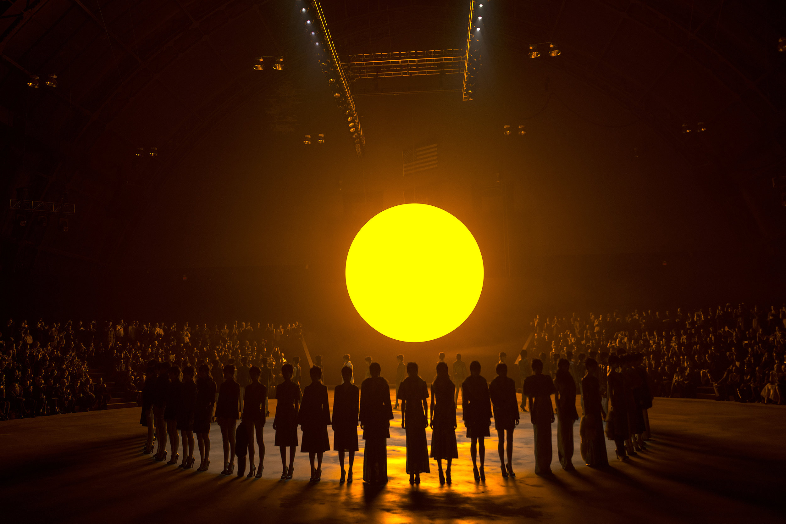  Models present creations from the &nbsp;Marc Jacobs Autumn/Winter 2013 collection under the glow of an artificial sun during New York Fashion Week. 