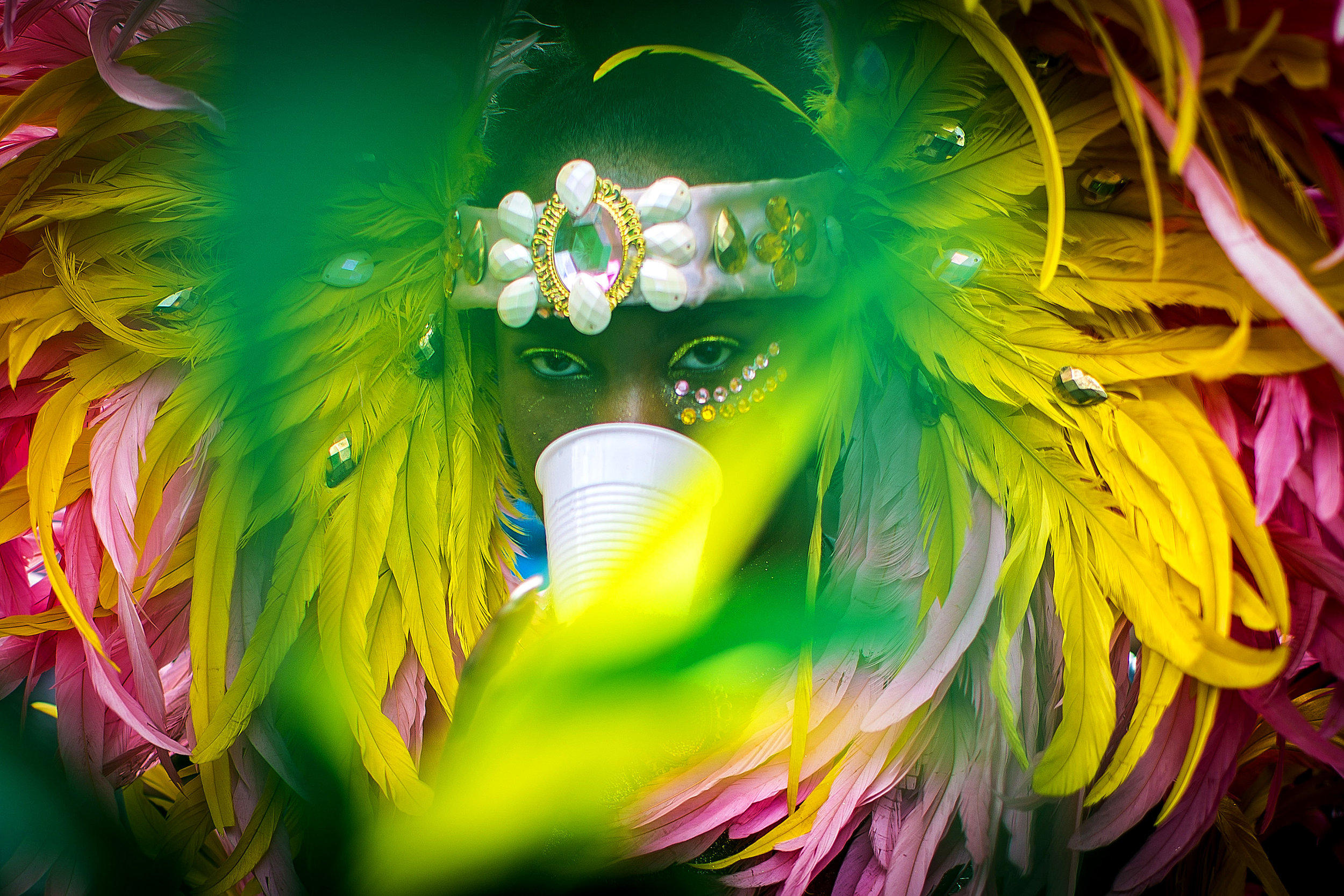  A woman carries a cup in her teeth as she marches in the Cambridge Carnival Parade in Cambridge, MA, September 11, 2016.&nbsp; 