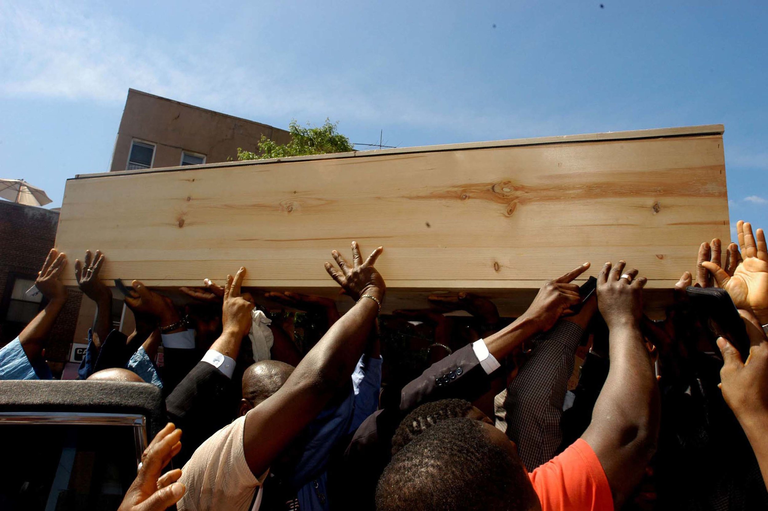  Mourners carry the coffin of African mmigrant Ousmane Zongo during his funeral &nbsp;in New york City. Zongo was shot in killed by police in a raid of a warehouse where he had a store front. 