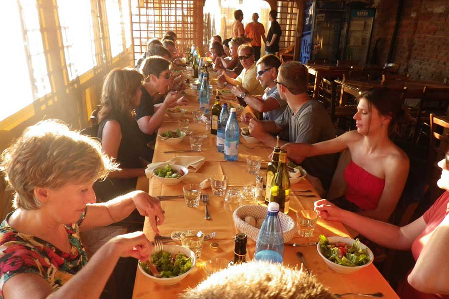  Participating artists and spouses enjoy a group dinner at one of our artist travel workshops in France 