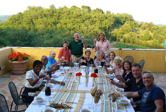  A group dinner on the final evening of an artist travel workshop in Italy. Taylor Smith's artist travel workshops bring artists and art lovers together for an intensive week of art instruction and workshop skills 