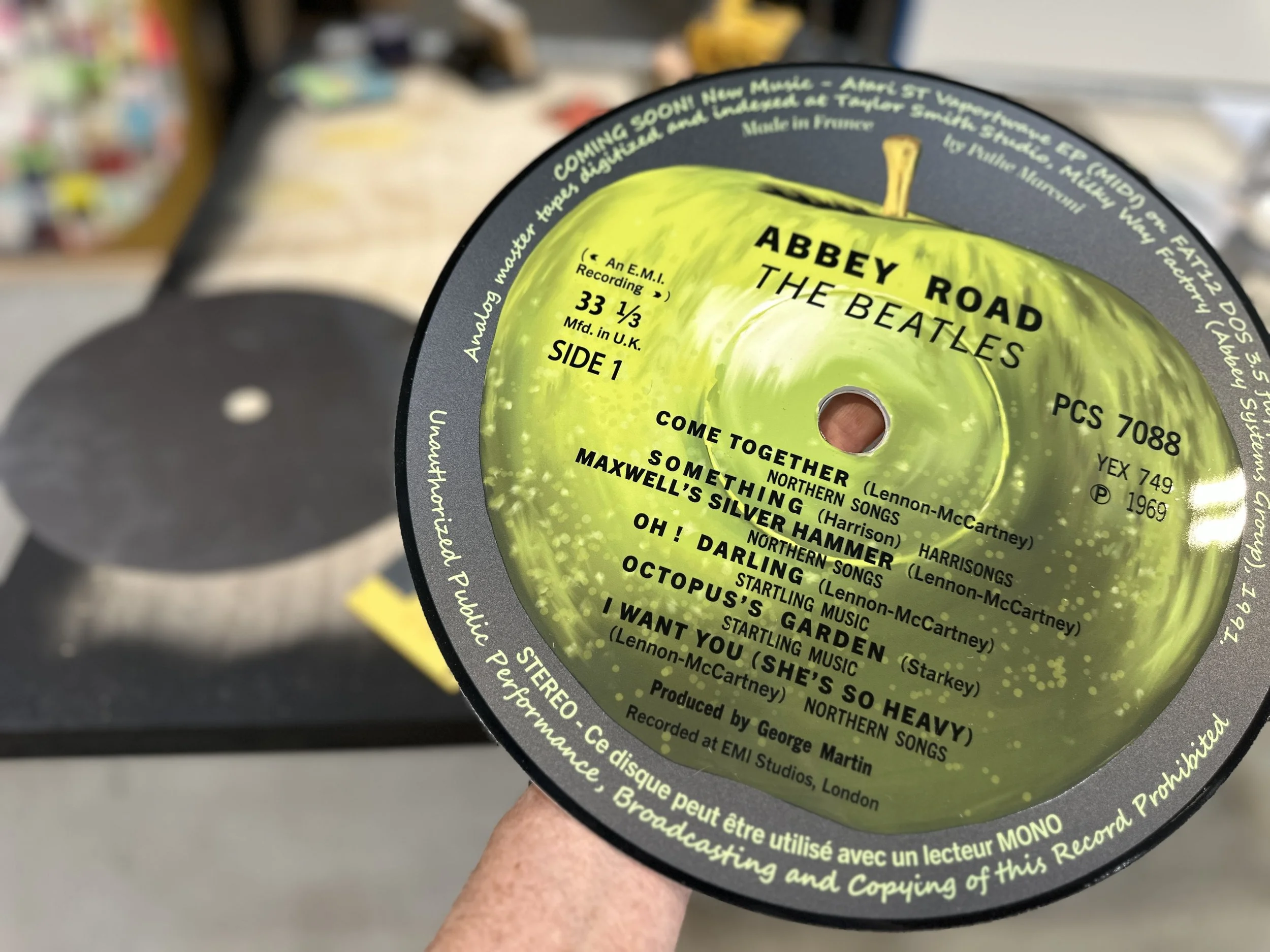 Close-up of the custom Abbey Road Side 1 aluminum center disc created for Taylor Smith’s Vinyl Series. 