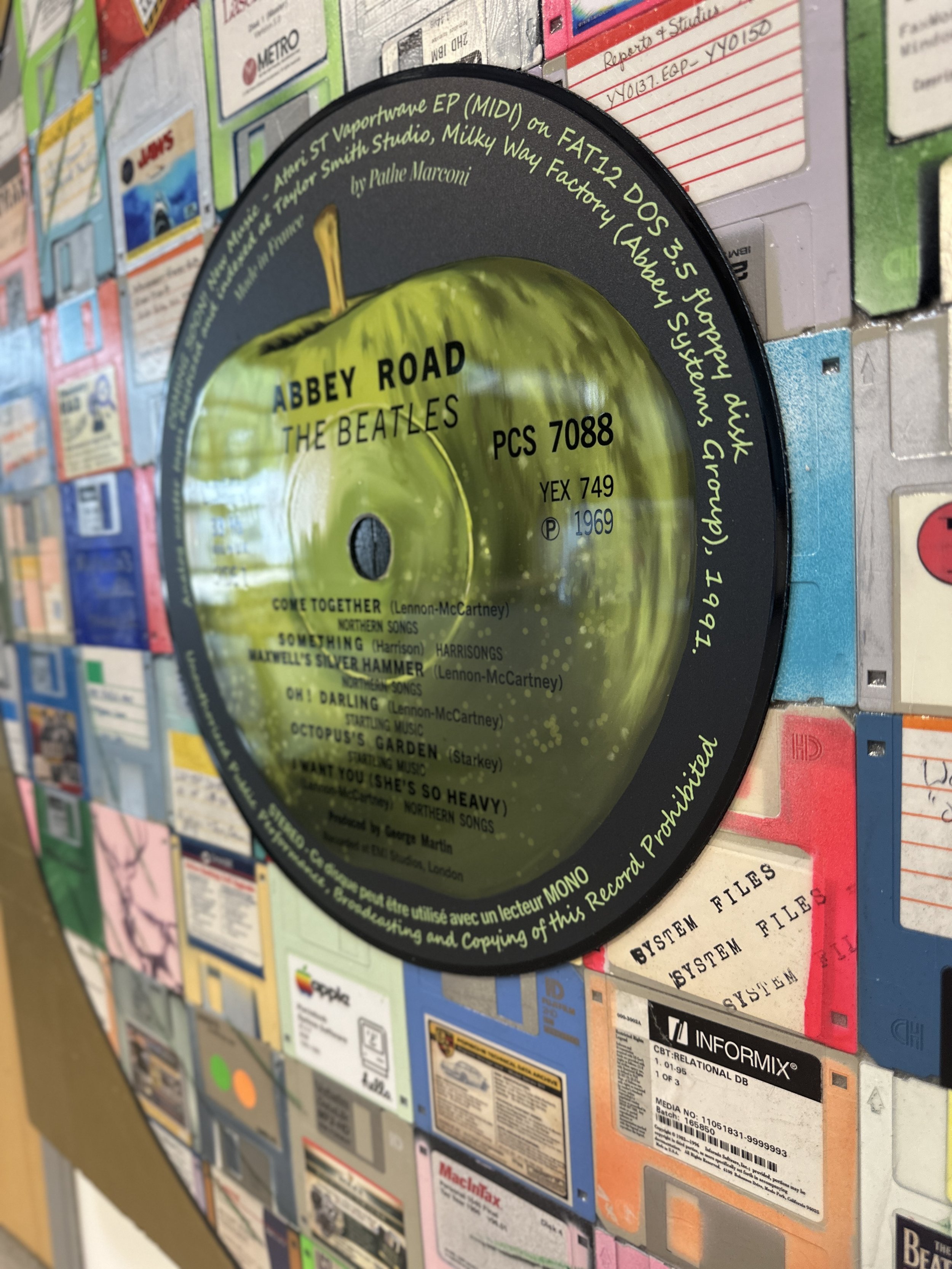  Detail of the Abbey Road Side 1 center disc installed over vintage floppy disks in the finished artwork. 