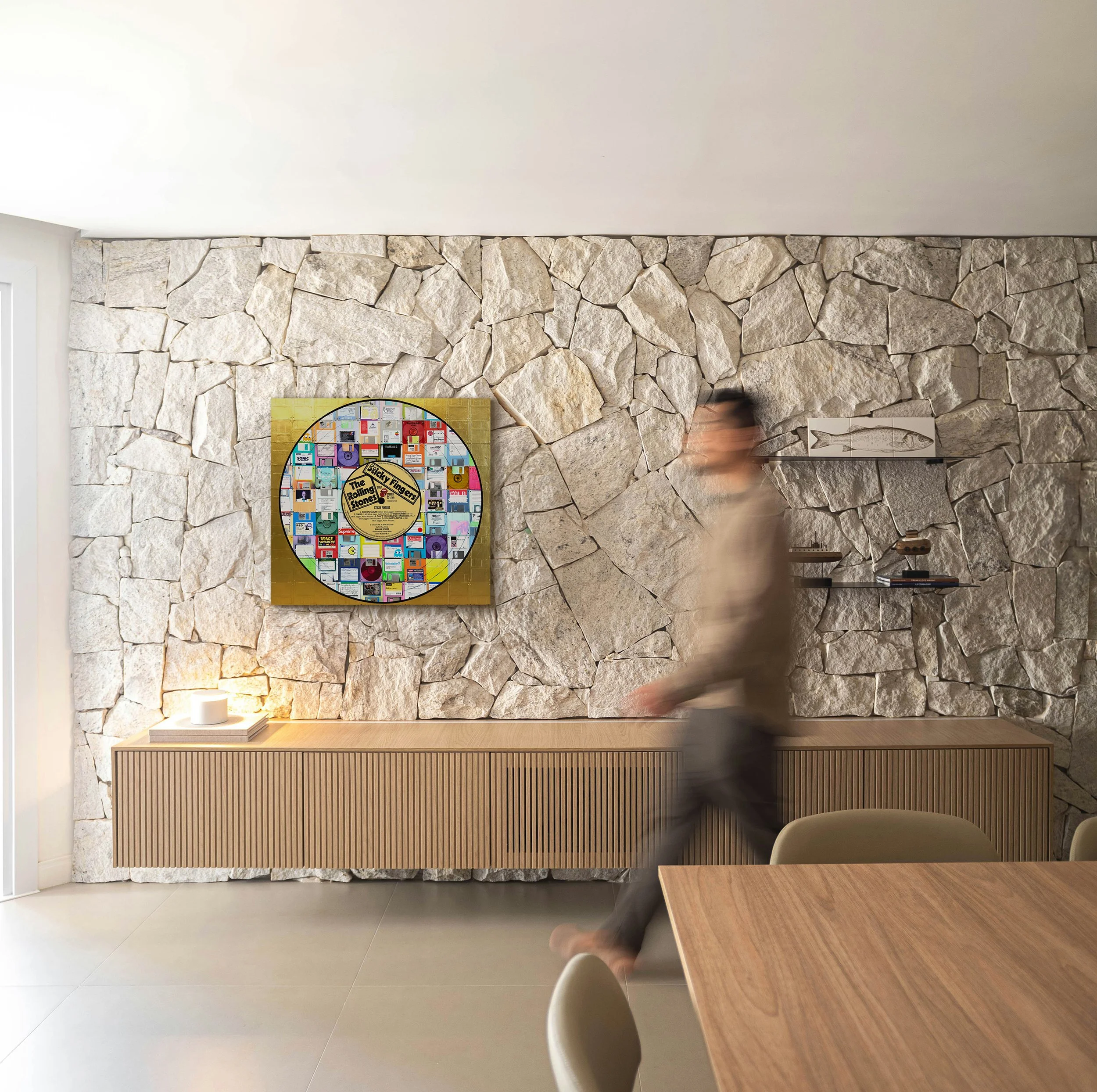 Sticky Fingers (Side 1) by Taylor Smith, a Rolling Stones-inspired Vinyl Series artwork displayed in a contemporary stone-wall interior.