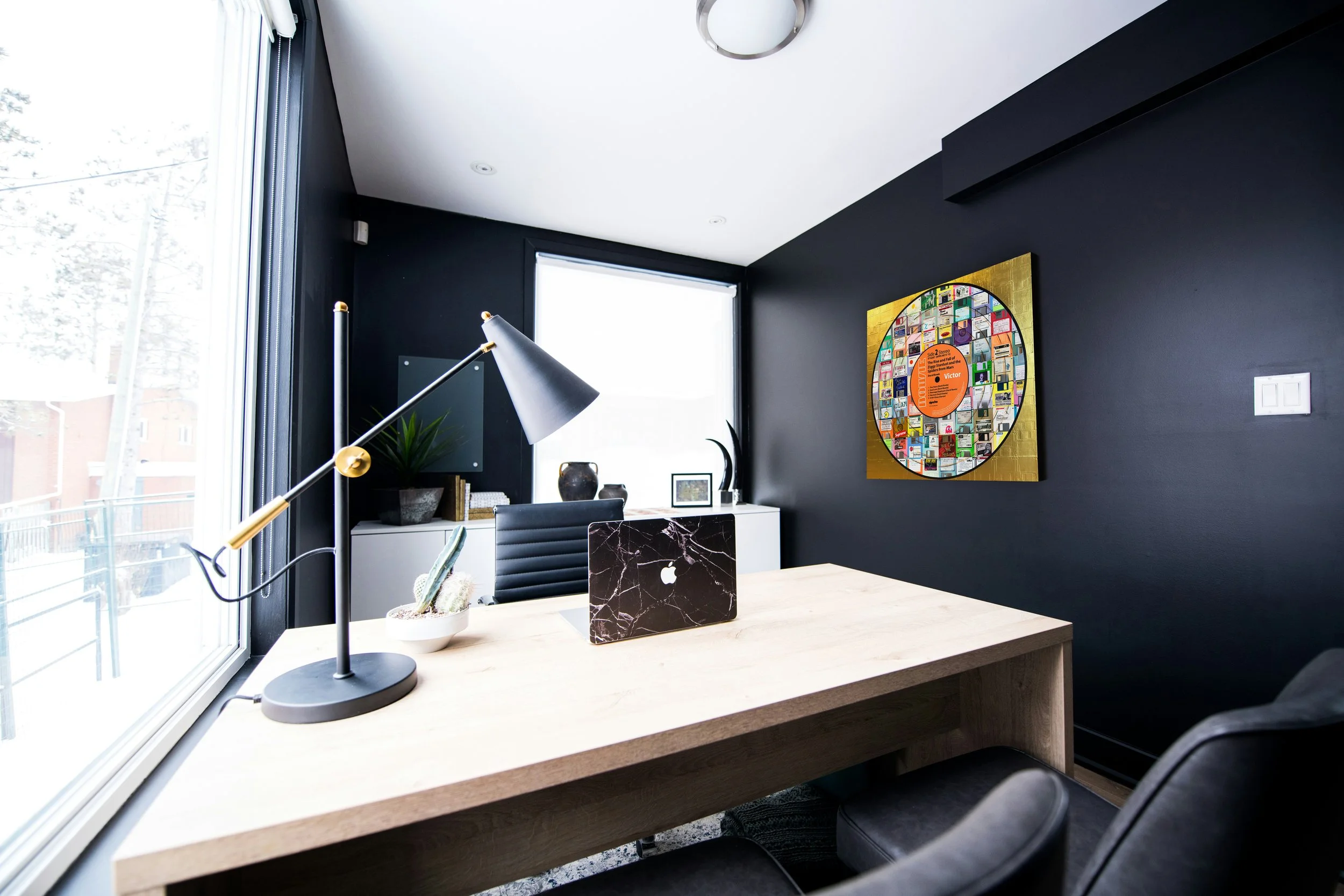Taylor Smith’s David Bowie Ziggy Stardust (Side 2) mixed-media Vinyl Series artwork displayed on a black wall in a contemporary office interior.