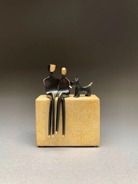 Caress Couple With Dog on Tan Limestone