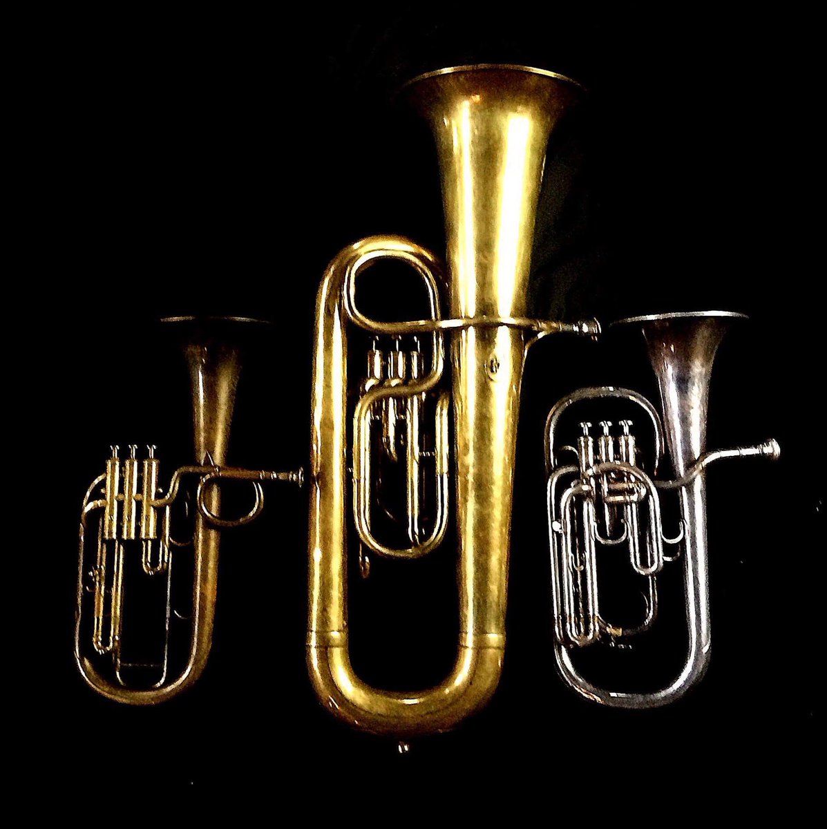 Left to Right: Tenor saxhorn in F/E flat/D by Antoine Courtois (Paris, c. 1855), sold by Arthur Chappell (London), Contrabass saxhorn in E-flat by E. Daniel (7167, Marseille, c. 1850), Tenor saxhorn in E-flat by Boosey & Co (47317, 295 Regent Street, London, 1900).