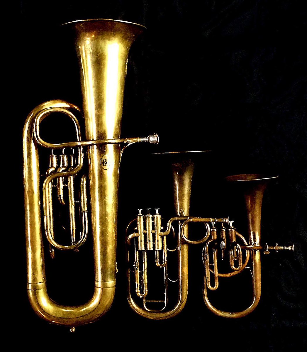 Left to Right: Contrabass saxhorn in E flat by E. Daniel (7167, Marseille, c. 1850), Tenor saxhorn in F/E flat/D by Antoine Courtois (Paris, c. 1855), sold by Arthur Chappell (London) , Contralto saxhorn in B-flat by J. Grass (32 Rue des Ponts de Comines, Lille, est. 1868.