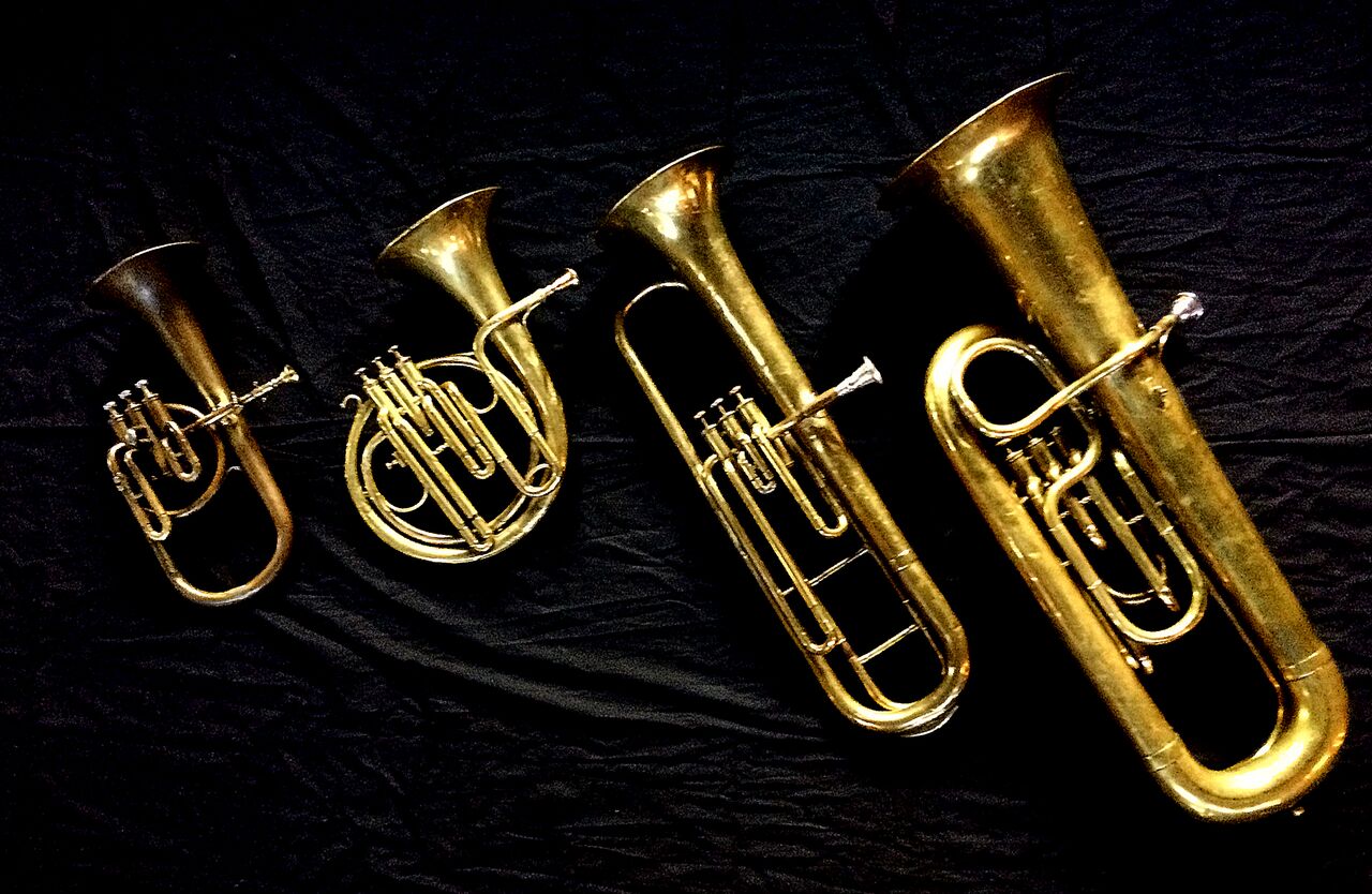 Left to Right: Contralto saxhorn in B-flat by J. Grass (32 Rue des Ponts de Comines, Lille, est. 1868), Ventilhorn in E-flat by Distin (4760, Gt. Newport Street, London, c.1862), Baritone saxhorn in C/B flat by Couturier (Lyon, c. 1865) , Contrabass saxhorn in E-flat by E. Daniel (7167, Marseille, c. 1850).