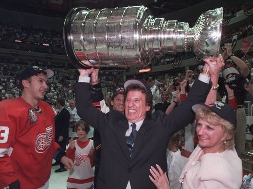Mike Ilitch hoists the Stanley Cup in 1998. Photo by Julian H. Gonzalez, Detroit Free Press
