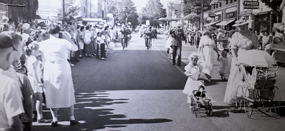 Downtown Pentwater during a parade in August of 1957, photo via Muskegon Chronicle
