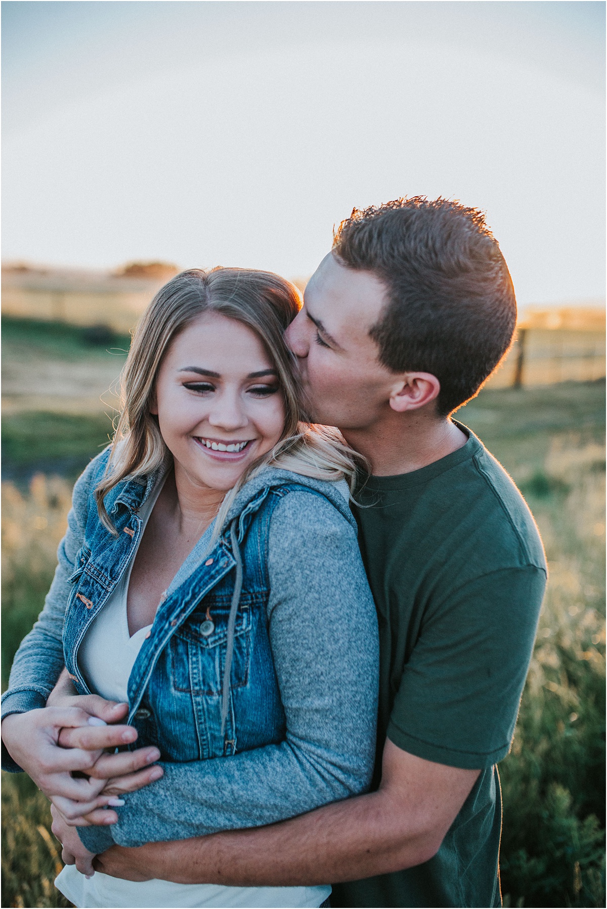 Couple poses at sunrise in Grand Teton National Park during a hot air balloon festival. These were taken by Celine Reese, a wedding photographer in Jackson Hole