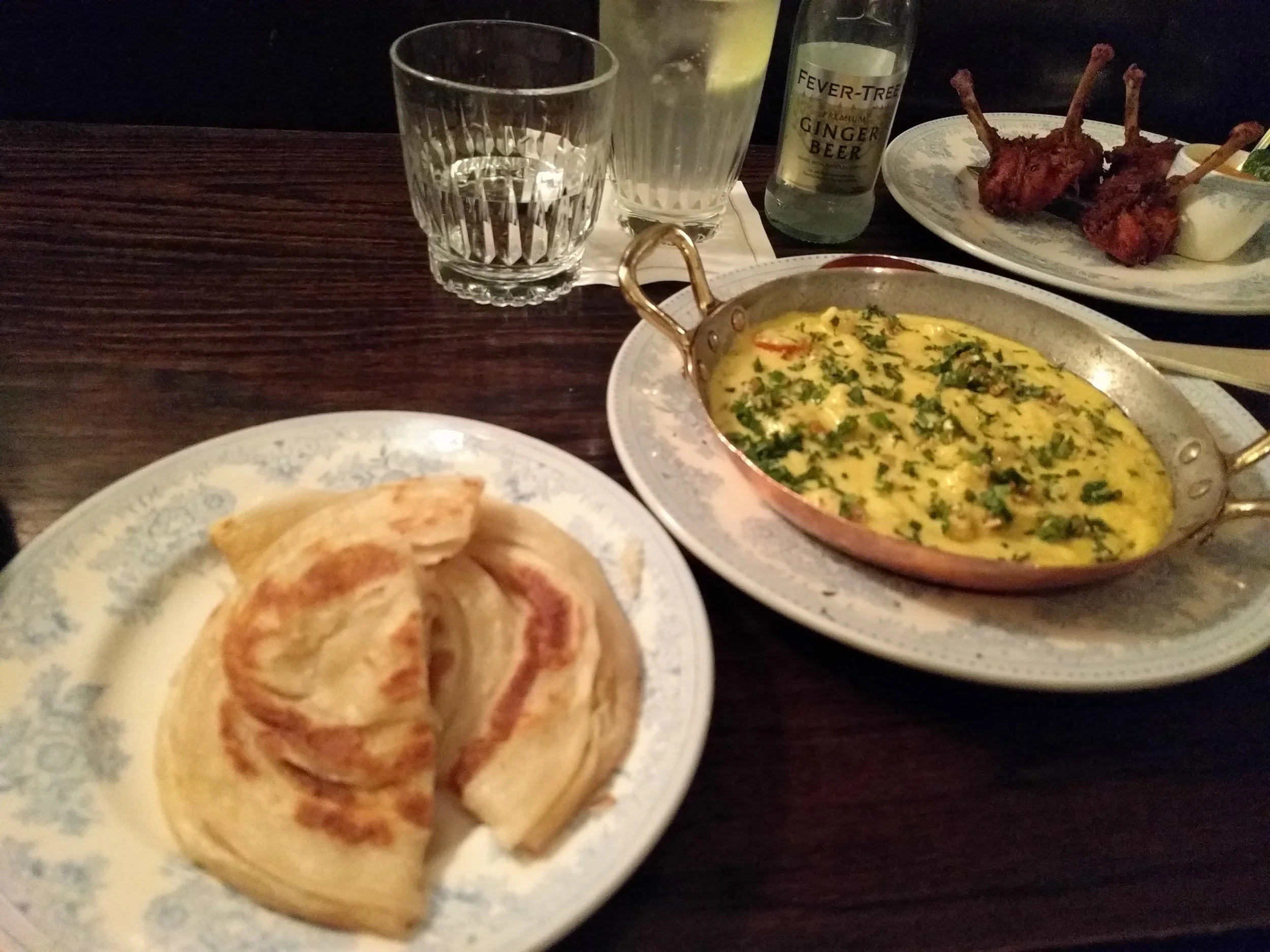 Egg bhurji with paratha and chicken wings from Gymkhana