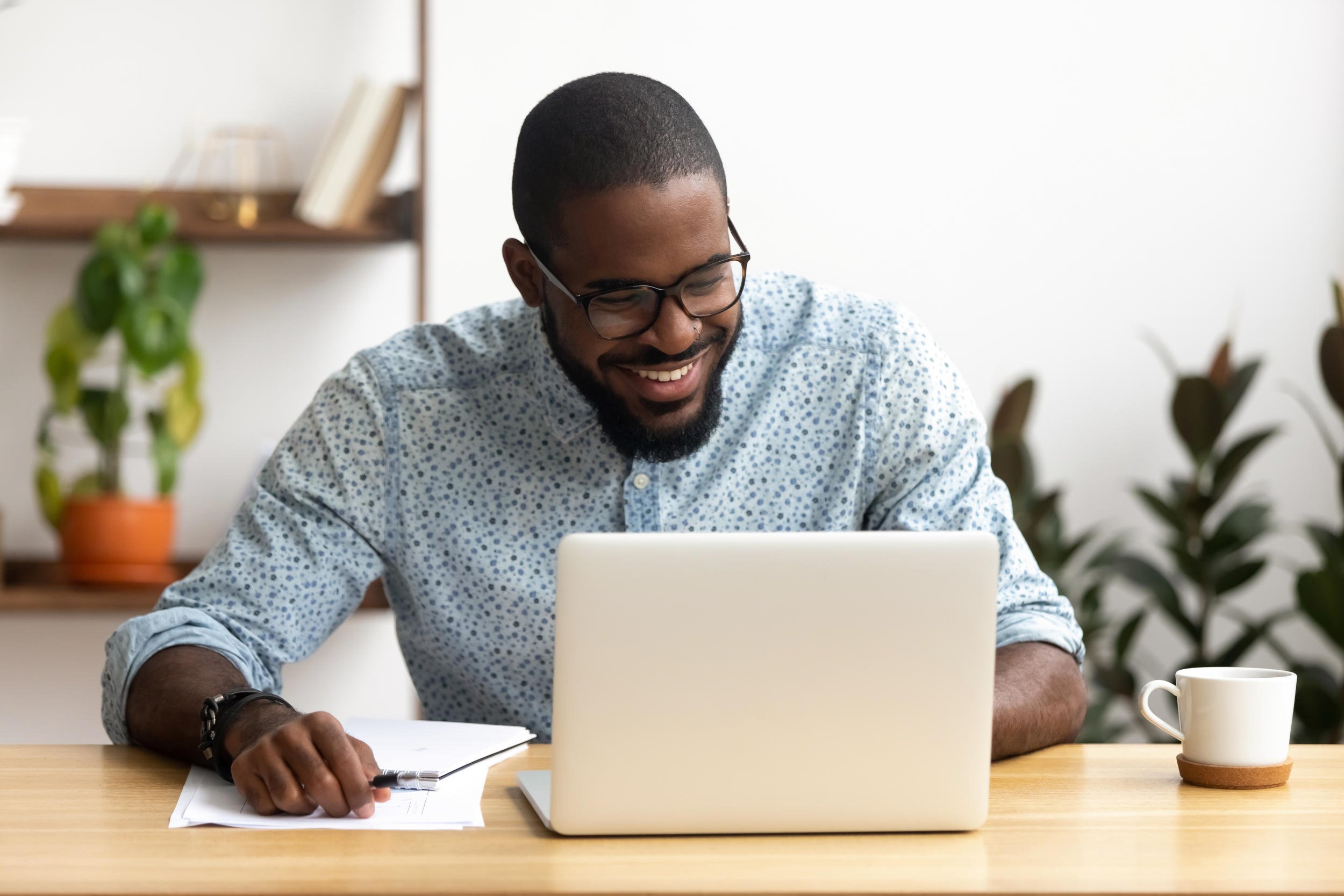 head-shot-smiling-african-american-manager-using-laptop-looking-at-screen-1156269801_6106x4071.jpeg