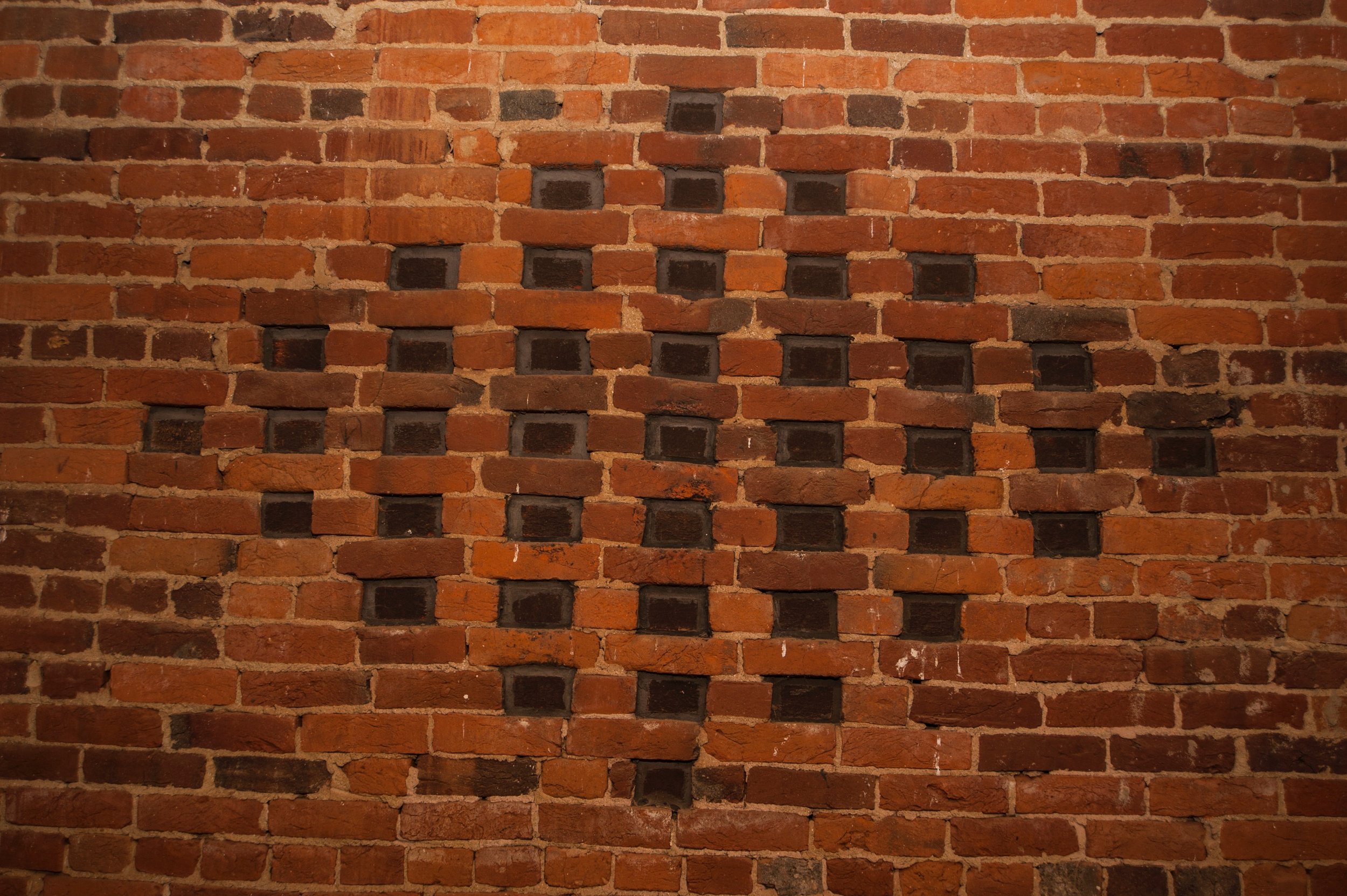  "Vents" were engineered by Allen Cochran to resemble the real thing. To give the illusion of openings, he set black bricks on end and recessed them.   