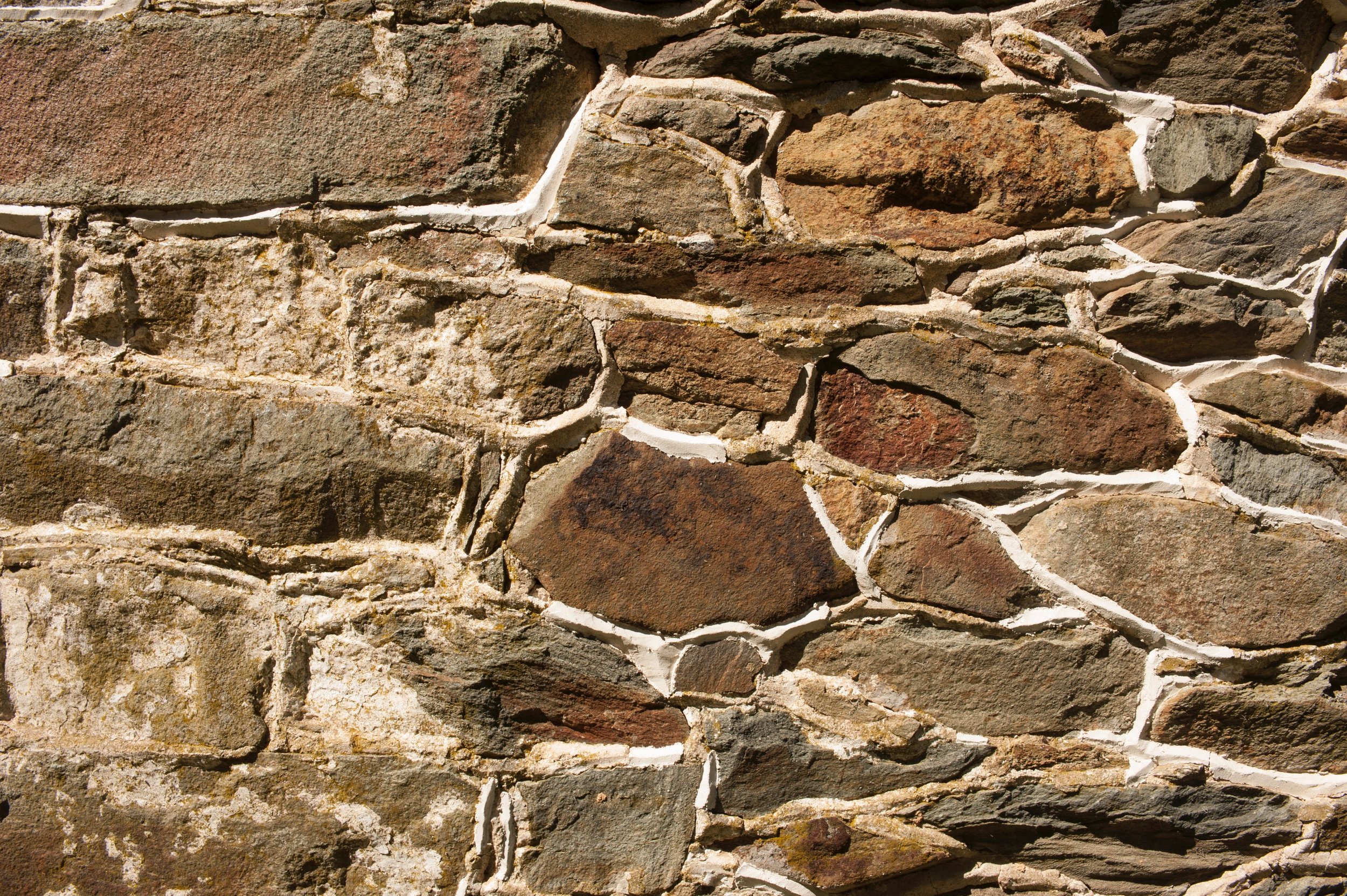  New masonry matches original farmhouse stonework. 