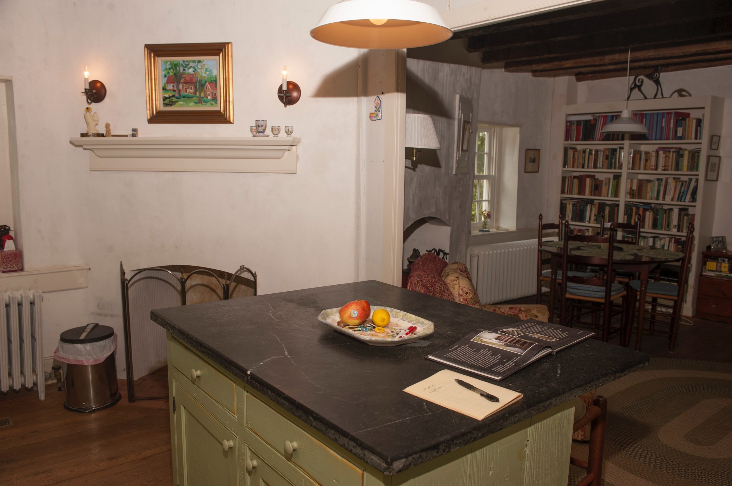  Renovated kitchen features new island and cabinets built to suit a 1740s structure. 