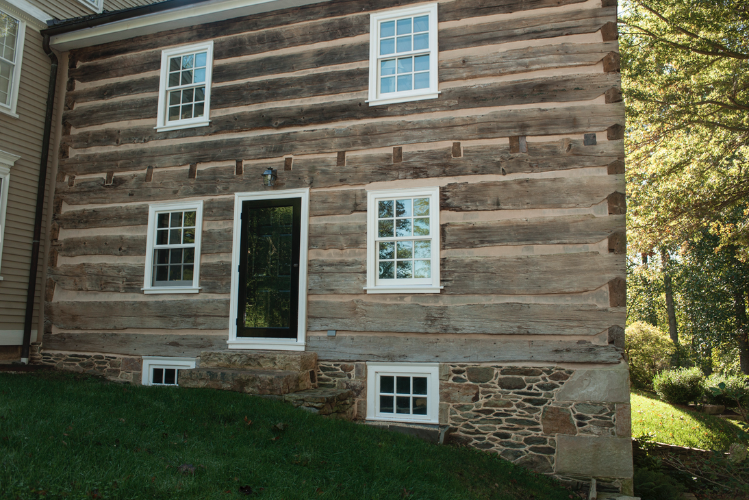  Three-level front facade of log building. 