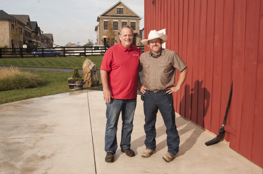  Mike Bailey, the developer's point man on the barn reconstruction, with Allen Cochran. 