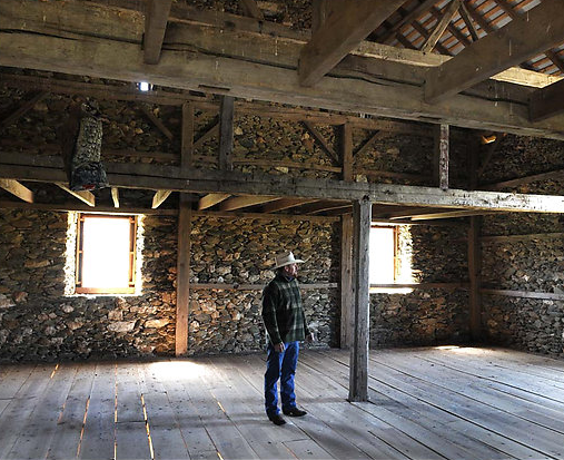 Allen Cochran in a barn outside Middleburg that his company built for Alan Croft over three years. The barn is a replica of a shed that once sat near the Dulles Greenway and the Route 7 Bypass. "As far as I'm concerned," he said, the barn is "our crown jewel."