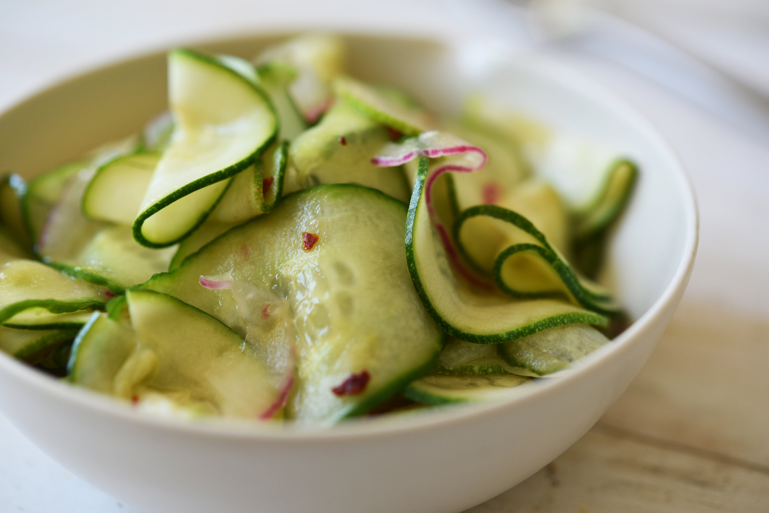Image of Cucumbers and zucchini in a salad
