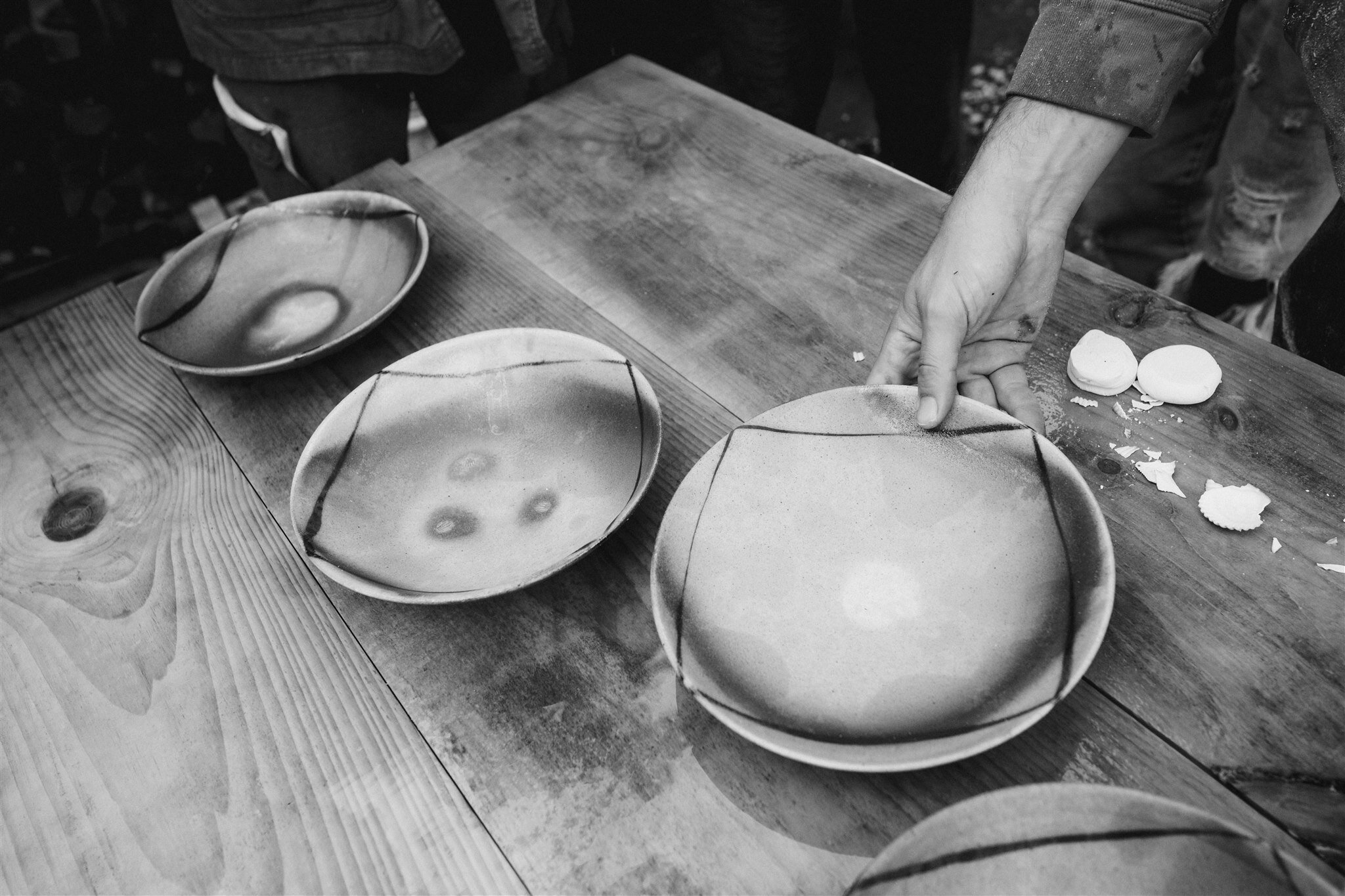 Images from the unload. I love how @shenyleon captured how our hands relate to pottery. It is so tender. After the kiln cooled for a few days, all the folks who helped fire it joined back together to unload the pots. We formed a line, and passed each