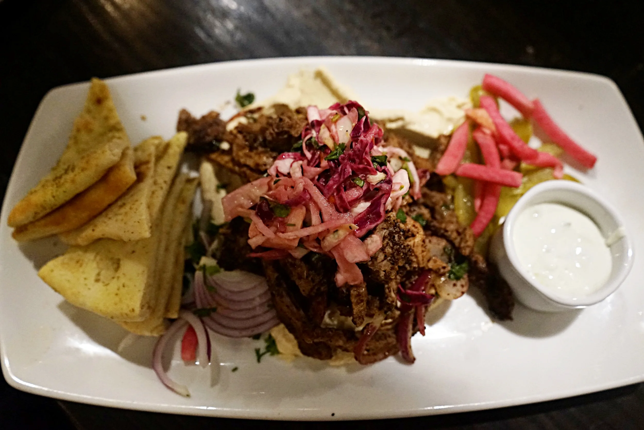 Shawarma Platter. roasted lamb. hummus. tomatoes. pickled cucumber + onion.