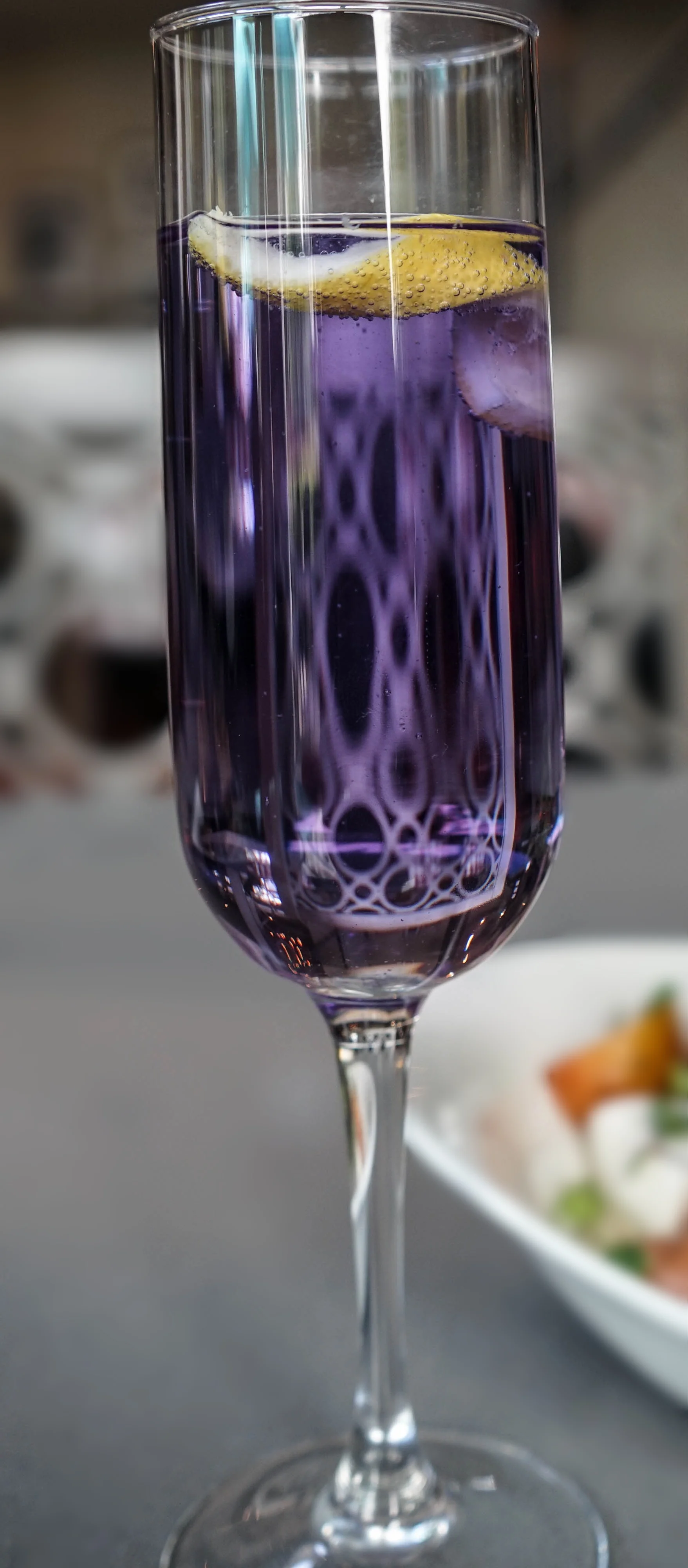 French 75. empress indigo gin. prosecco. lemon