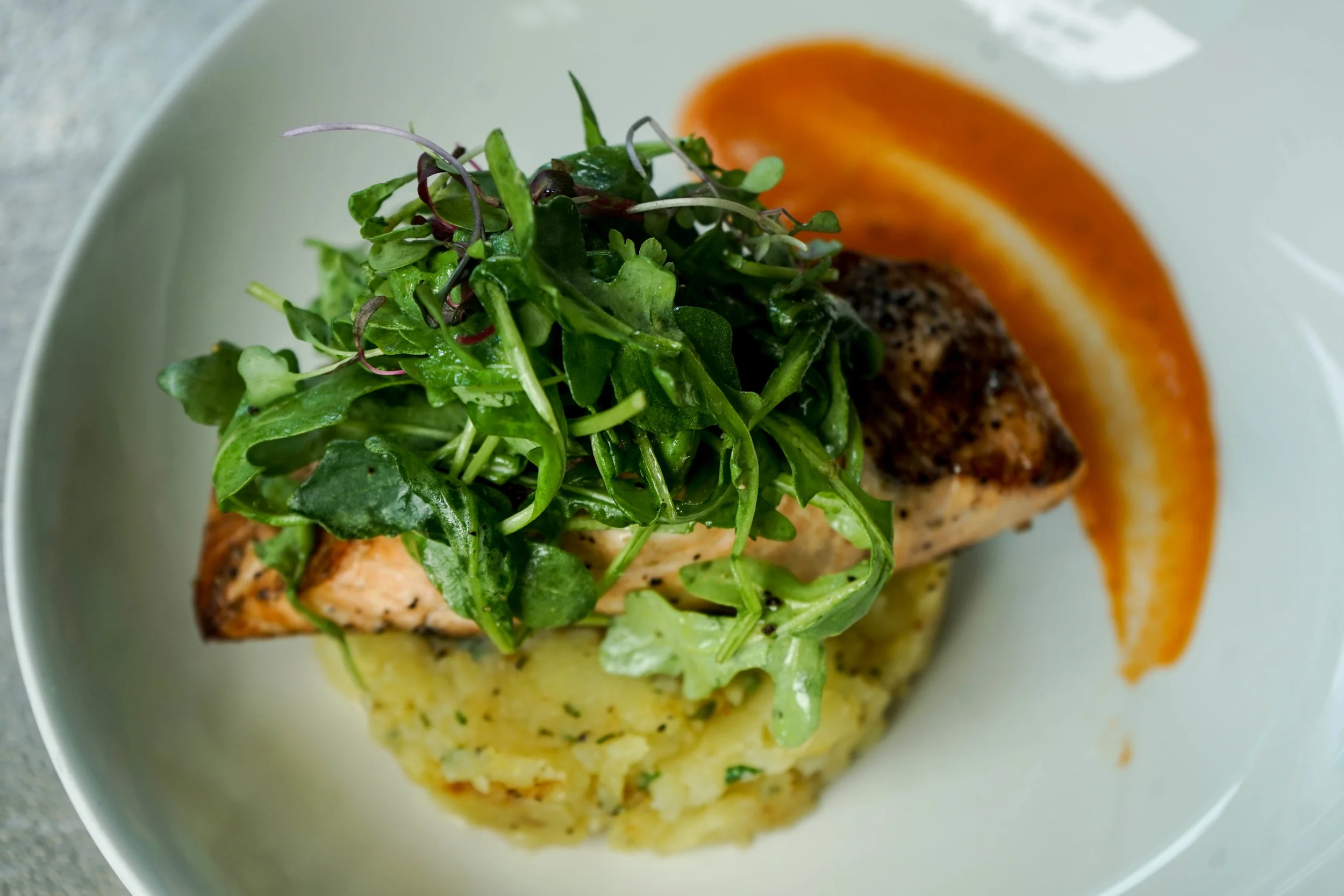Fresh Catch (salmon). grilled scottish salmon. herb crushed potatoes. smoked tomato sauce.