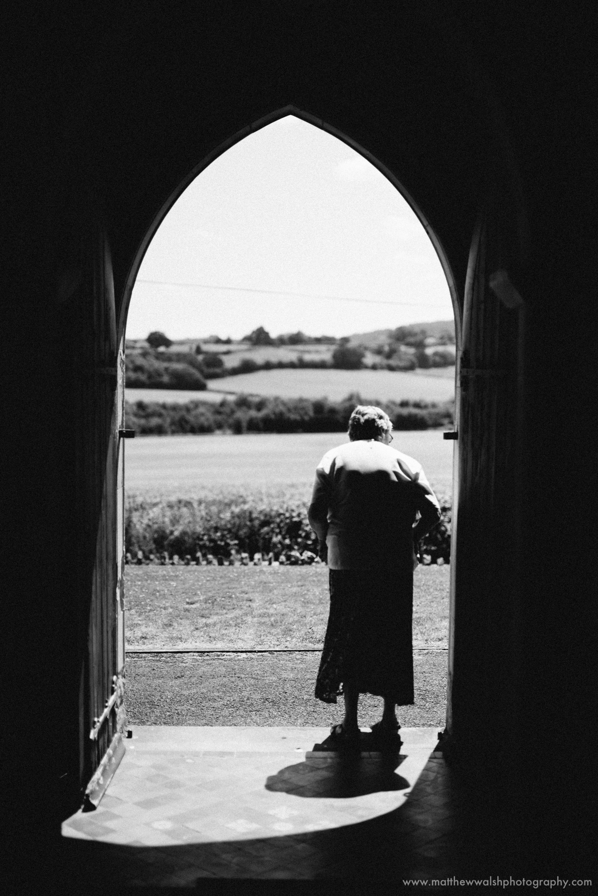 Church lady looking for signs of the bride who is running a little late now
