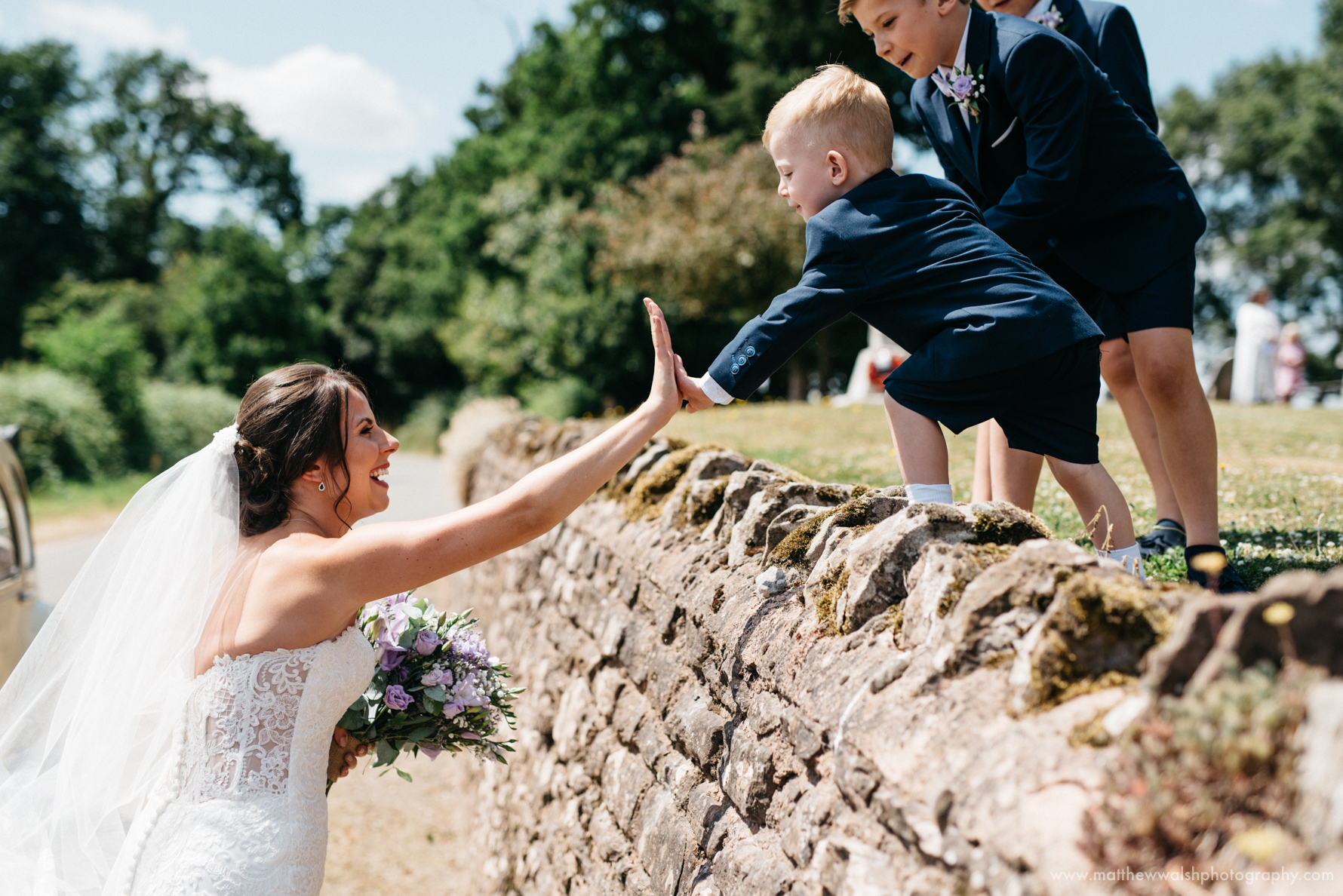High 5 time for the bride and little boy