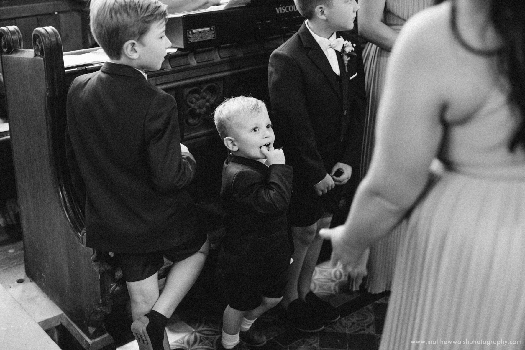 Image of a cute little page boy having fun during the ceremony