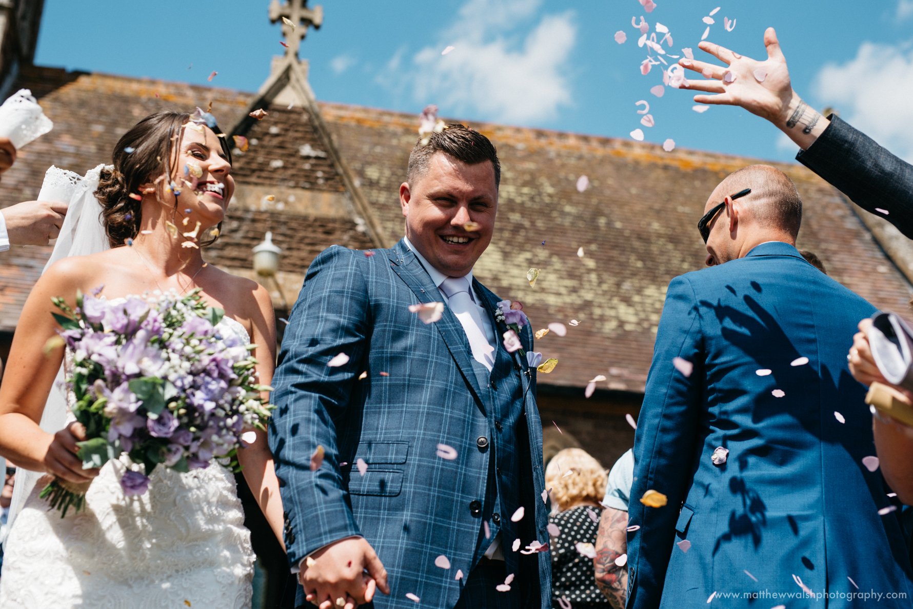 Bride and groom showered with confetti in a perfect moment 