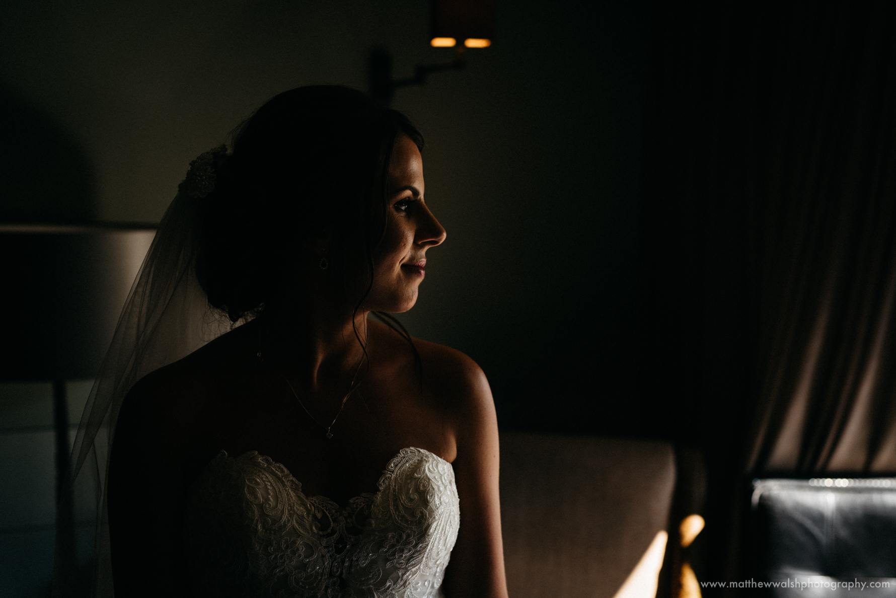 The bride in a pocket of natural light