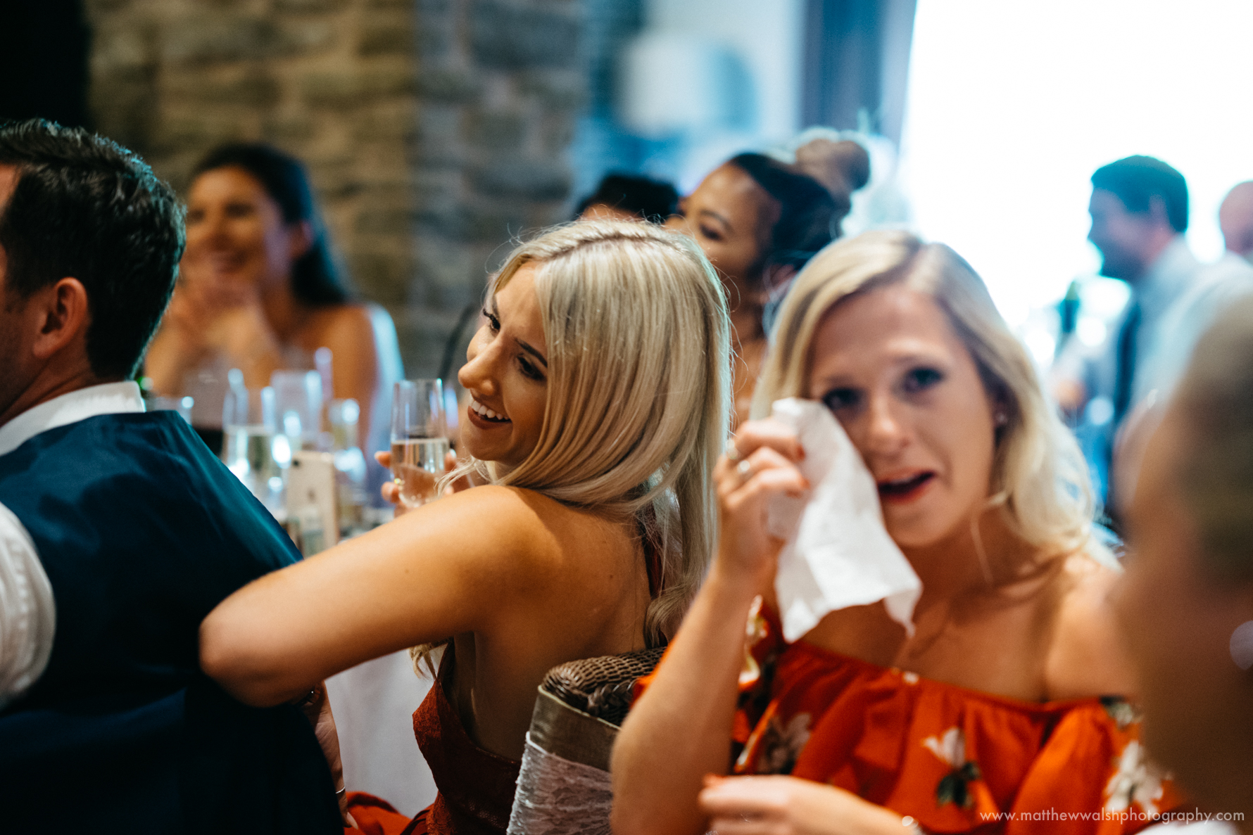 Guests laughing at the funny but intimate speeches