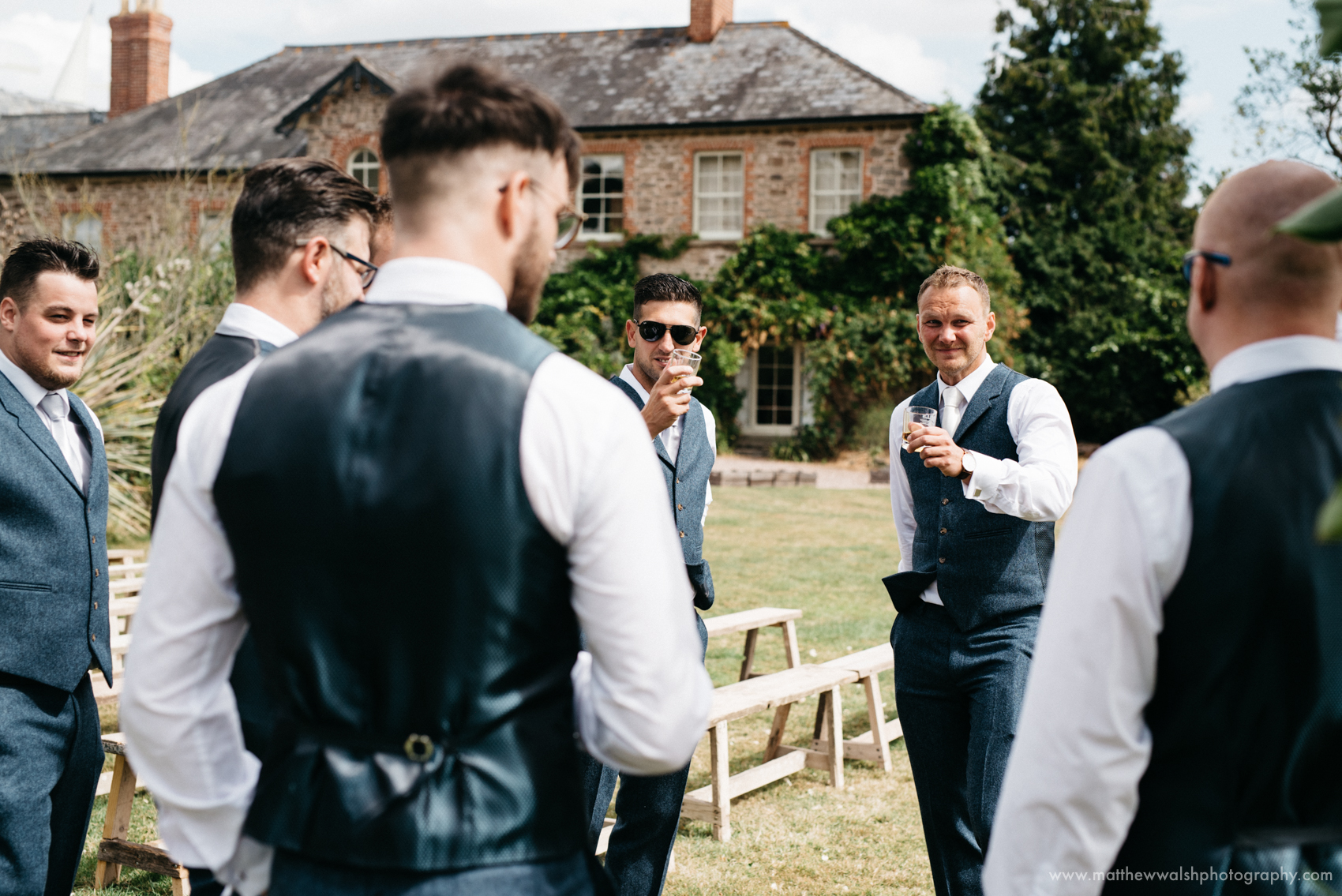 Groomsmen having a little pre ceremony banter with the groom