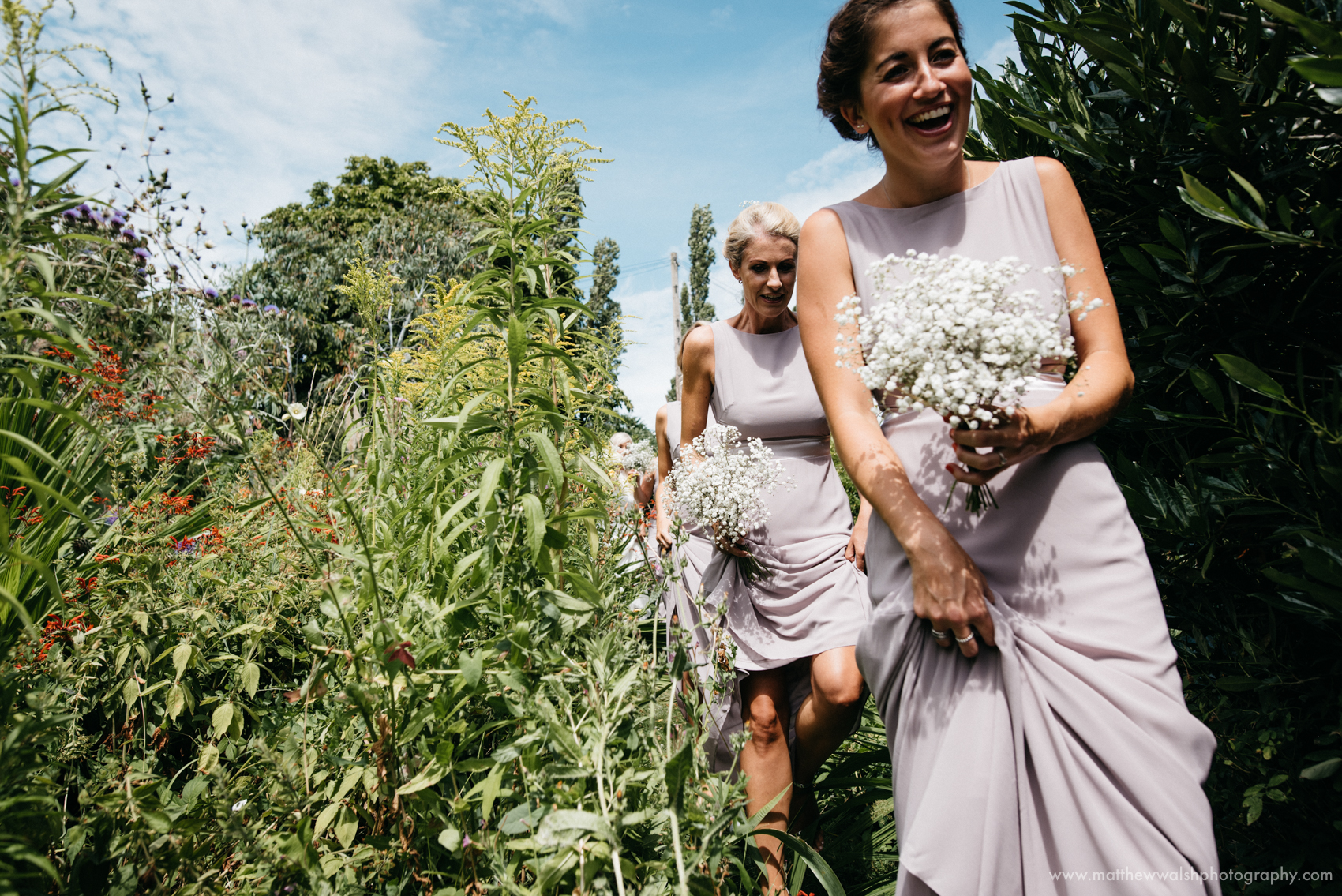 A bit of an adventure as the bridal party fight their way through the flowers