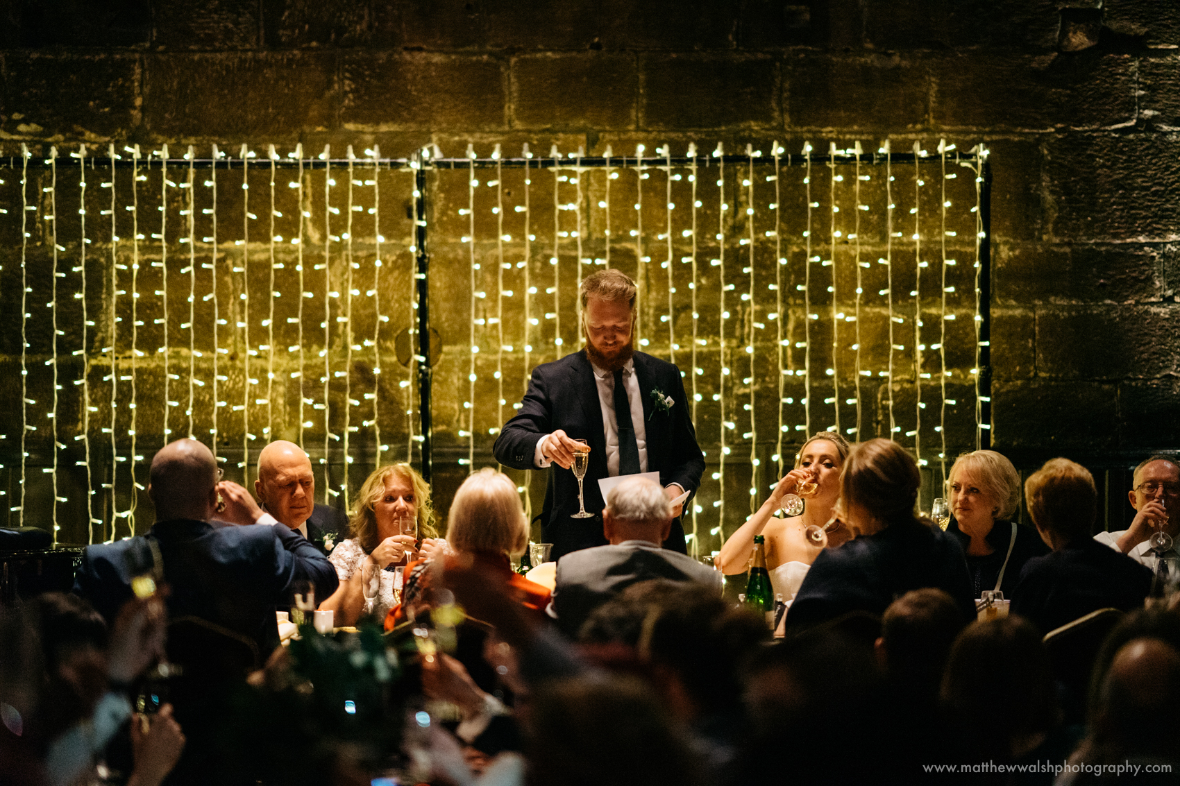 The groom makes a toast to his lovely new wife