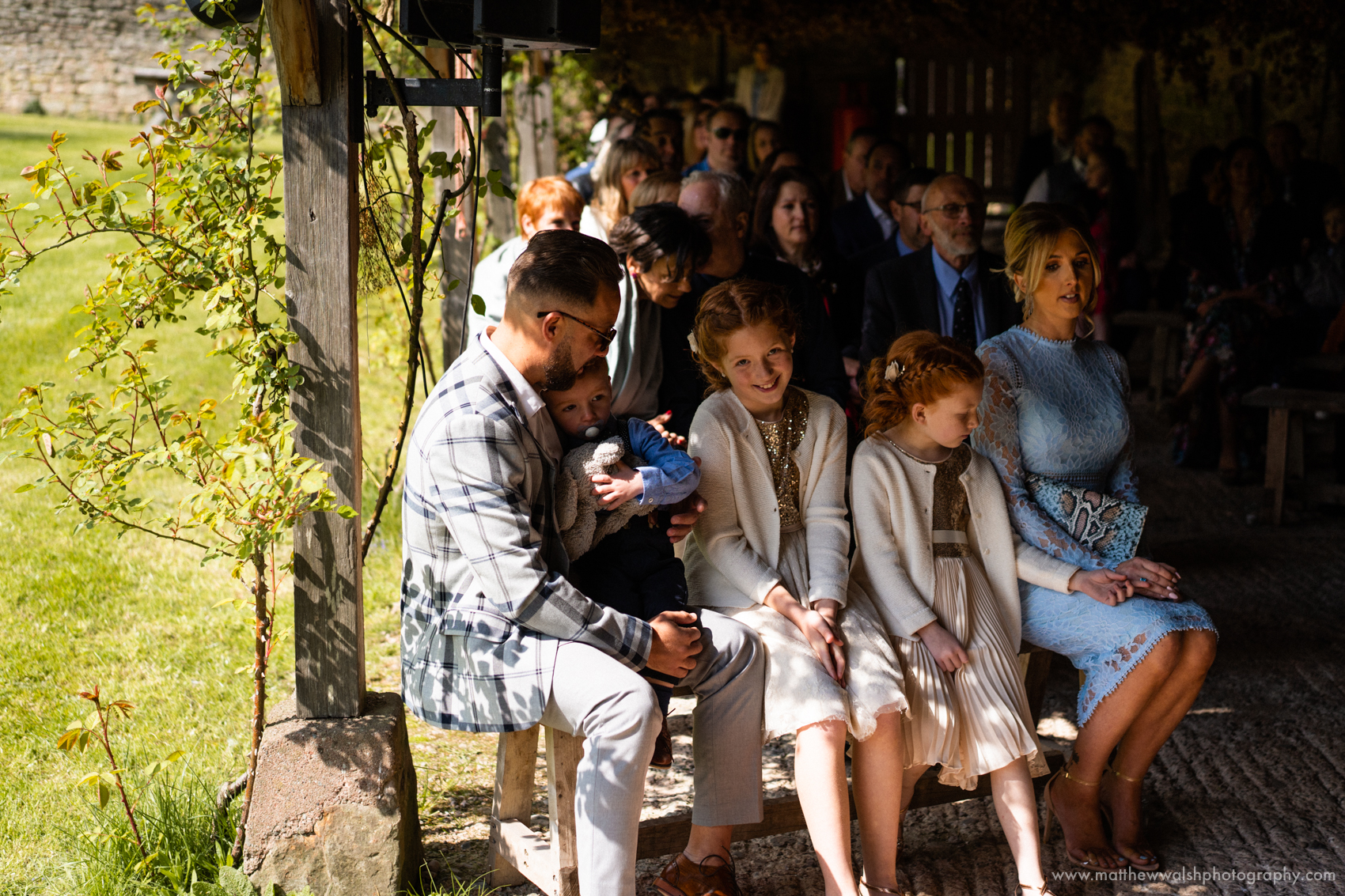 Family friends and natural light under the ceremony canopy