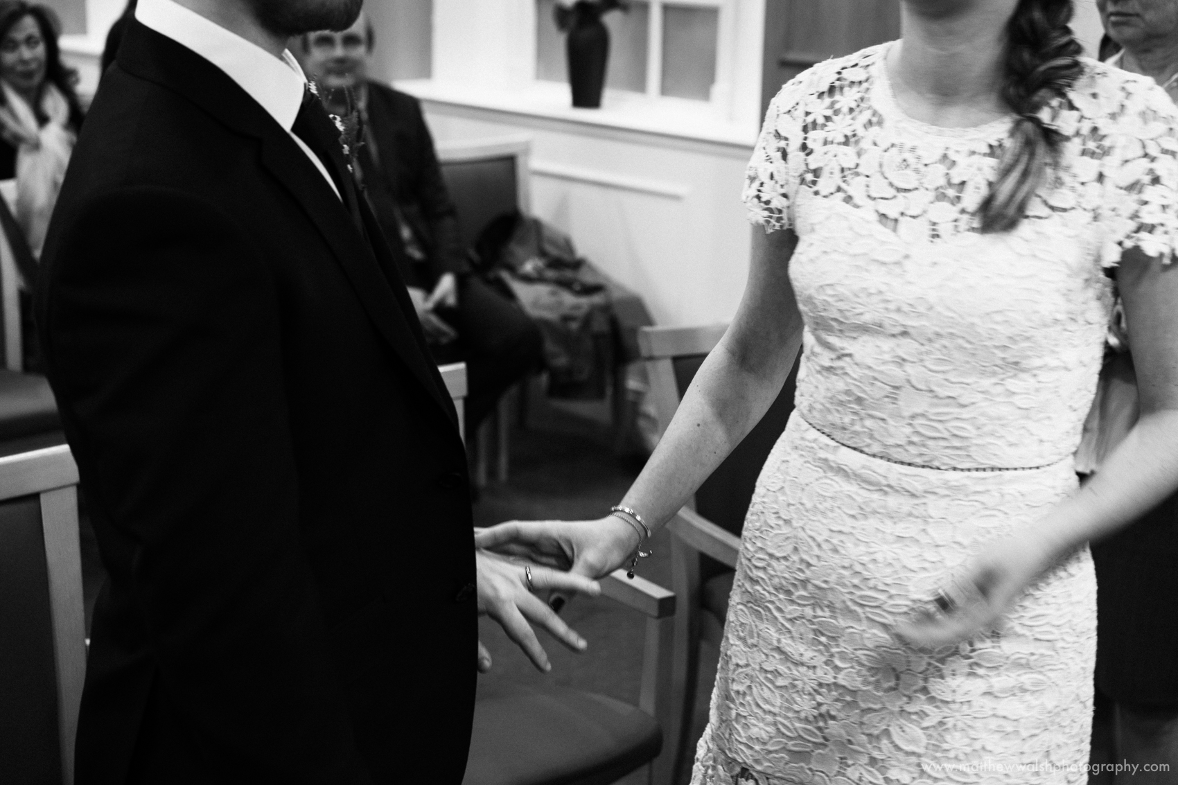The exchange of rings during the civil ceremony at Manchester Registry office