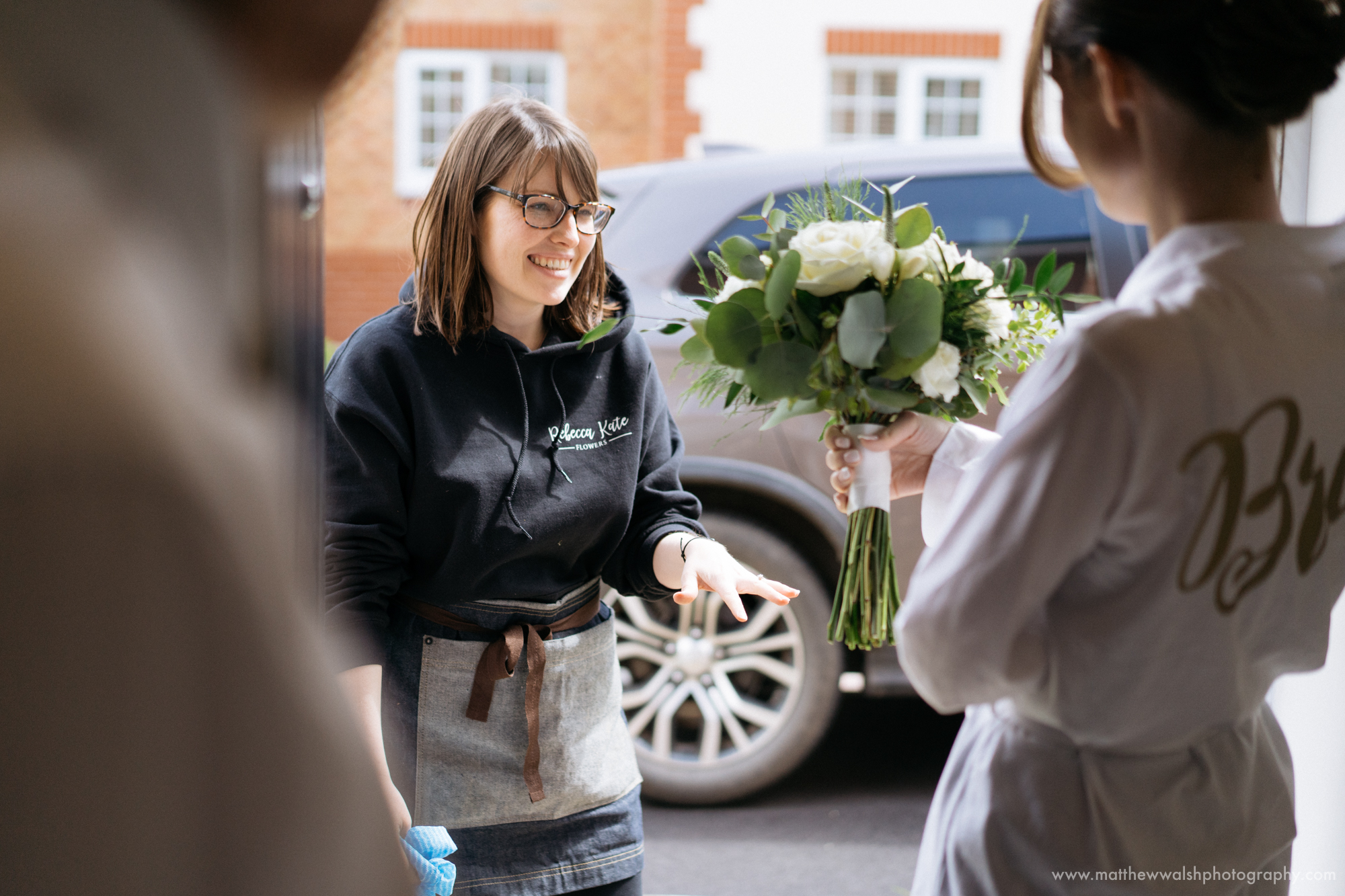 The florist Rebecca Kate Flowers arrives with the brides bouquet and other flowers
