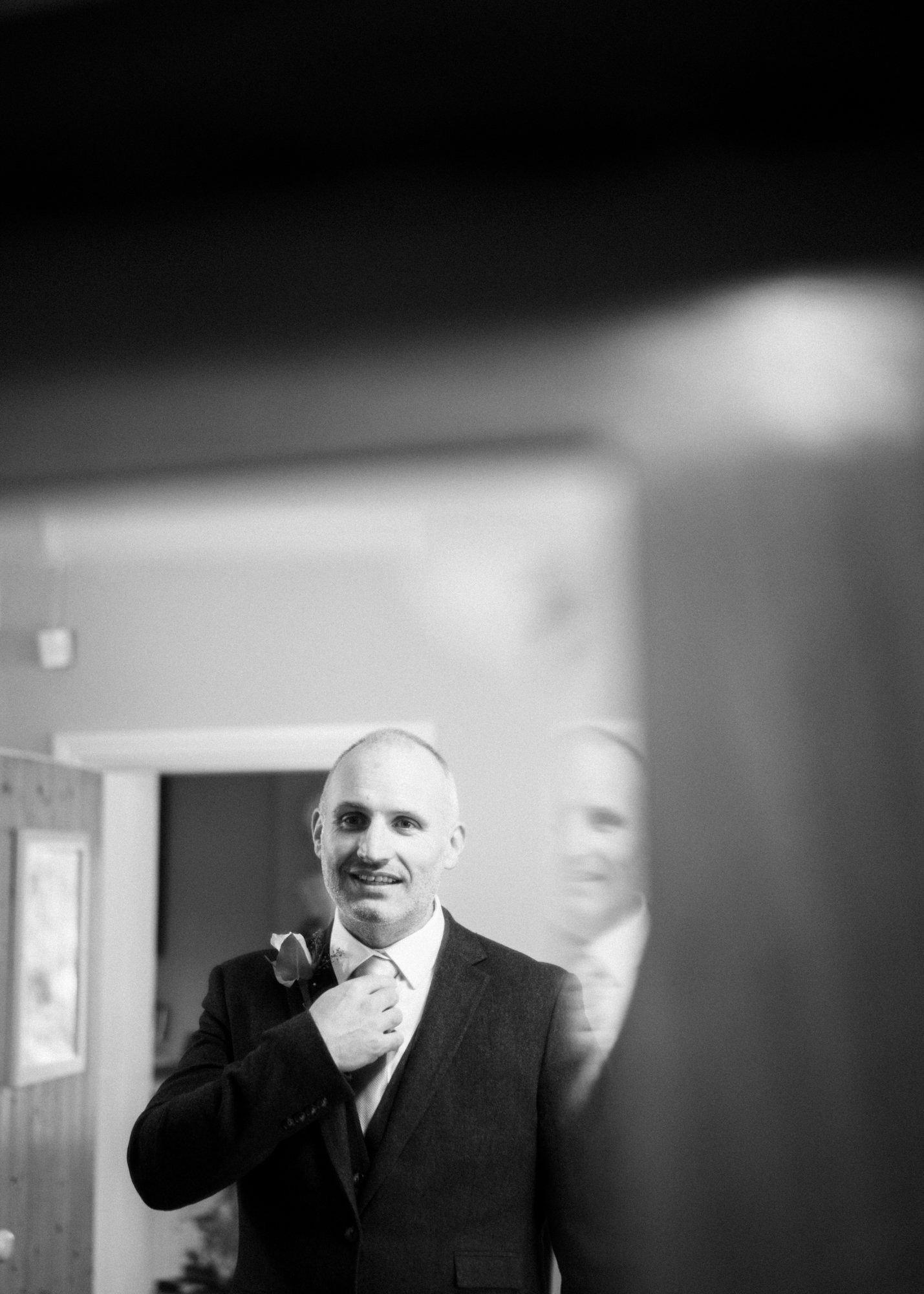 Reflection of the groom