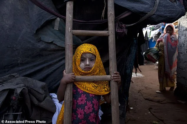 1366569-4897570-A_Rohingya_Muslim_girl_Yasmin_Ara_stands_in_front_of_her_shanty_-a-1_1505850699008.jpg