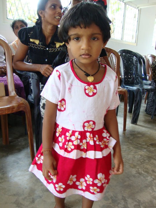 A little girl modelling the uniform - she was a little overwhelmed as I asked if she could model it and the mother had whipped her clothes off before she could say BOO!