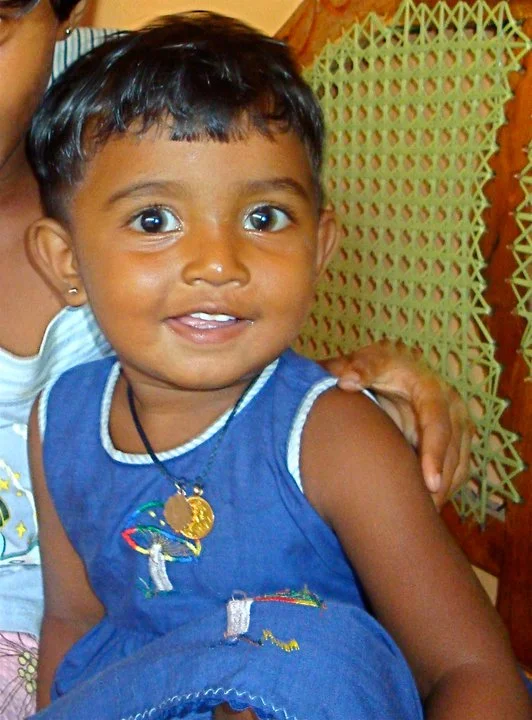 This little girl's mummie died of cancer last year so we assisted her family to look after her by extending the auntie's house there is also another sister!